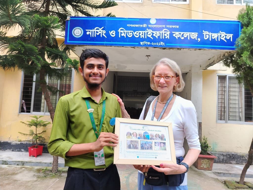 Tanvir Ahmad with Elizabeth Anne McLellan holding a framed certificate at Nursing and Midwifery College, Tangail