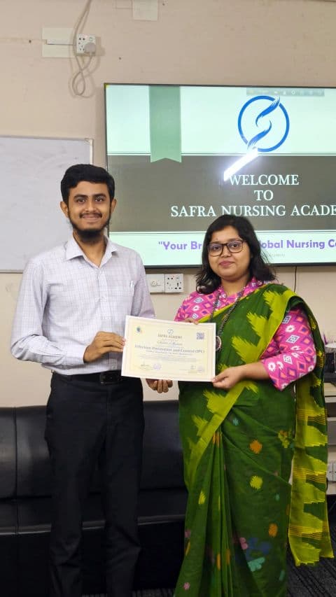 Tanvir Ahmad receiving the Infection Prevention and Control certificate at Safra Nursing Academy